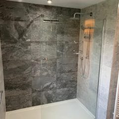 Large shower with grey tiles - Thomson Properties