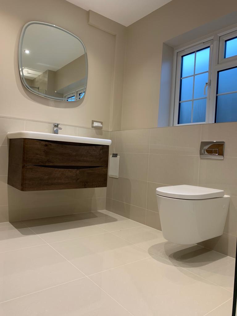 Wall hung units and toilet in this bathroom refurbishment by Thomson Properties