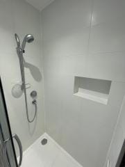 Shower niche within complete bathroom refurbishment by Thomson Properties, Surrey and Sussex
