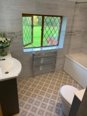 Patterned floor tiles in this complete bathroom refurbishment by Thomson Properties