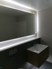 Bathroom refurbishment with illuminated mirror, fitted by Thomson Properties