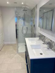 Complete bathroom refurbishment with patterned wall tiles and splashback, Thomson Properties