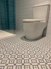 Statement patterned bathroom floor tiles, bathroom refurbishment by Thomson Properties, Kitchen & Bathroom Refurbishment Specialists, Surrey and Sussex