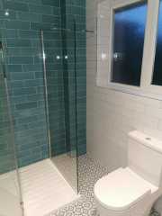 Bathroom metro wall tiles and patterned floor tiles, bathroom refurbishment by Thomson Properties, Surrey and Sussex