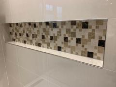 Mosaic tiled niche, bathroom installation in Surrey and Sussex by Thomson Properties