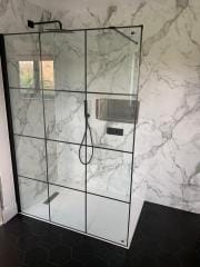 Monochrome shower area refurbishment by Thomson Properties