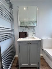 Bathroom refurbishment with grey units and marble tiles, fitted by Thomson Properties