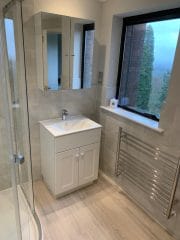 Grey bathroom installation Surrey Thomson Properties