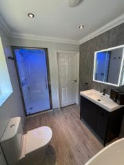 Mood lighting in steam shower pod by Thomson Properties