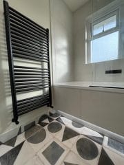 Monochrome bathroom installation Surrey - Thomson Properties