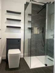 Monochrome shower room installation by Thomson Properties, Surrey and Sussex