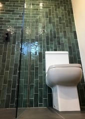 Green bathroom metro tiles, bathroom fitting by Thomson Properties