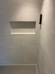 Shower wall niche as part of complete bathroom refurbishment by Thomson Properties