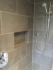 Shower room with grey wall tiles, complete bathroom refurbishment by Thomson Properties