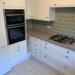 Kitchen wall grey metro tiles with white cupboards,  Thomson Properties