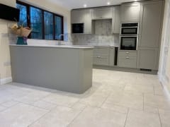 Grey shaker style kitchen with hexagonal wall tiles by Thomson Properties