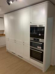 White shaker style kitchen cupboards with oven tower - Thomson Properties