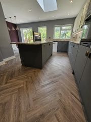 Herringbone kitchen flooring with grey cupboards, kitchen refurbishment by Thomson Properties